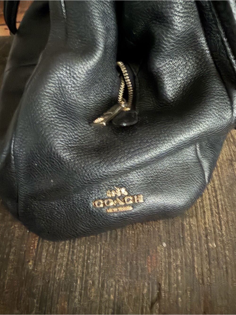 GENTLY USED COACH PEBBLED LEATHER DRAWSTRING WITH GOLD  COACH EMBLEM